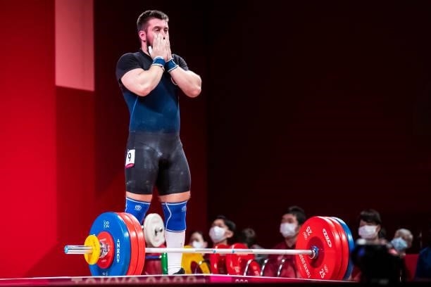 Yauheni Tsikhantsou of Belarus compete in the Men's 96kg Group B weightlifting competition on day eight of the Tokyo 2020 Olympic Games at Tokyo...