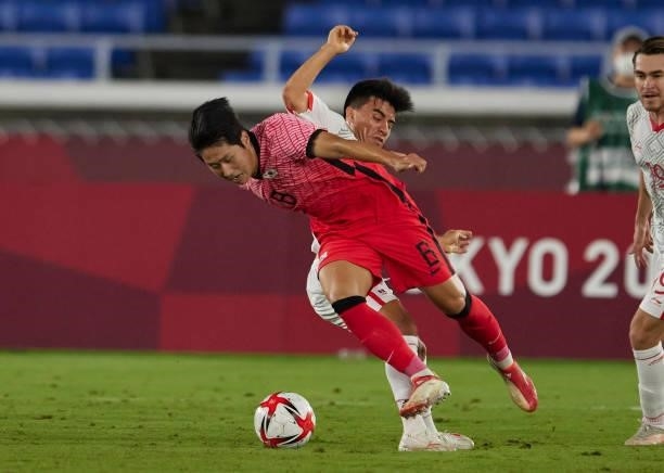Kang-in Lee of South Korea and Jesus Angulo of Mexico battle for the ball during the Men's Quarter Final match between Republic Of Korea and Mexico...