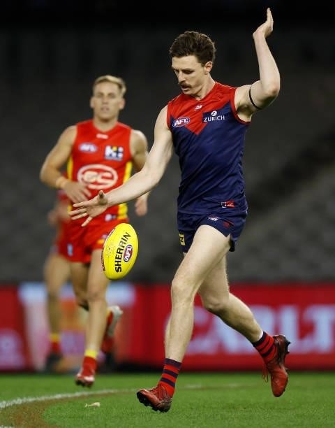 Jake Lever of the Demons kicks the ball during the 2021 AFL Round 20 match between the Gold Coast Suns and the Melbourne Demons at Marvel Stadium on...
