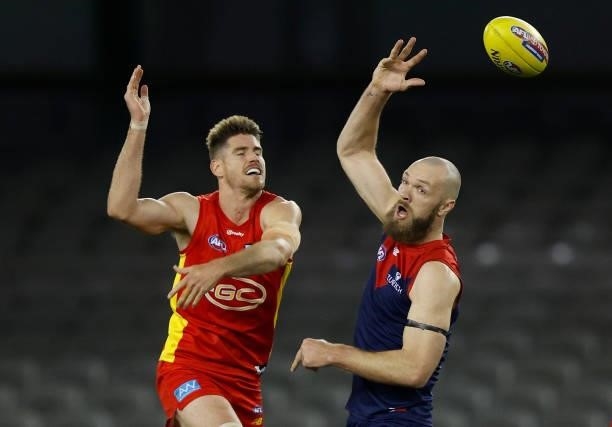 Zac Smith of the Suns and Max Gawn of the Demons compete in a ruck contest during the 2021 AFL Round 20 match between the Gold Coast Suns and the...