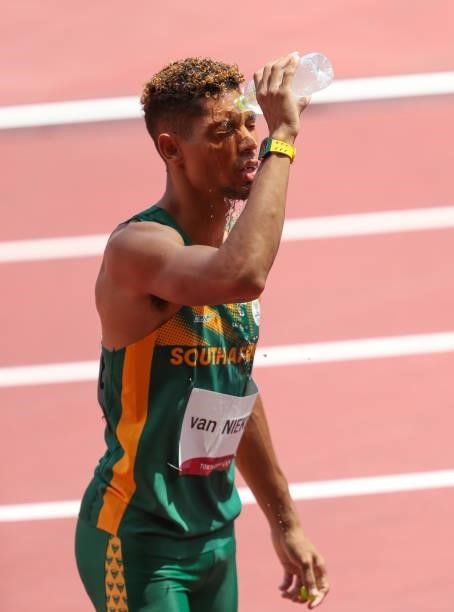 Wayde van Niekerk of South Africa, World and Olympic record holder in the mens 400m, cools his face with ice water due to the heat during the...