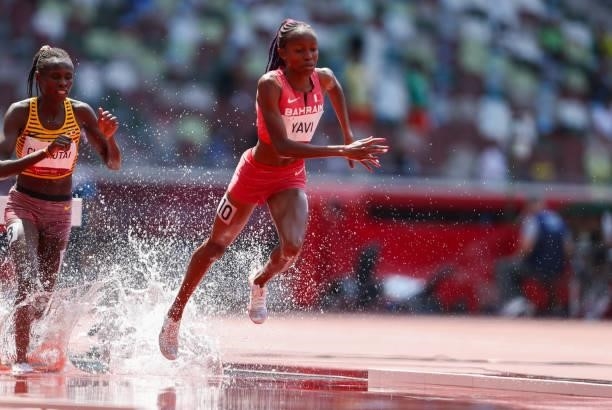 Winfred Mutile Yavi of Bahrain at the water jump in the heats of the womens 3000m steeplechase during the Athletics event on Day 9 of the Tokyo 2020...