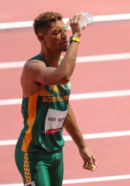 Wayde van Niekerk of South Africa, World and Olympic record holder in the mens 400m, cools his face with ice water due to the heat during the...