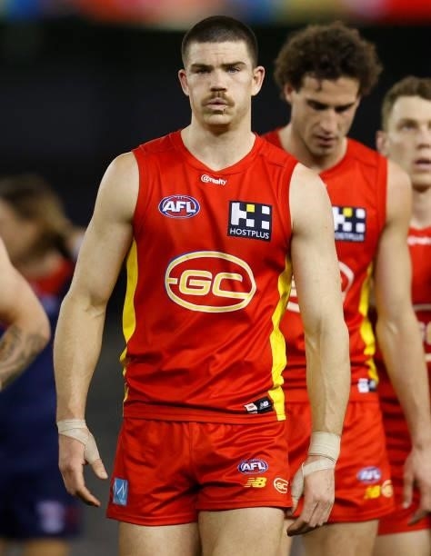 Sam Collins of the Suns looks dejected after a loss during the 2021 AFL Round 20 match between the Gold Coast Suns and the Melbourne Demons at Marvel...