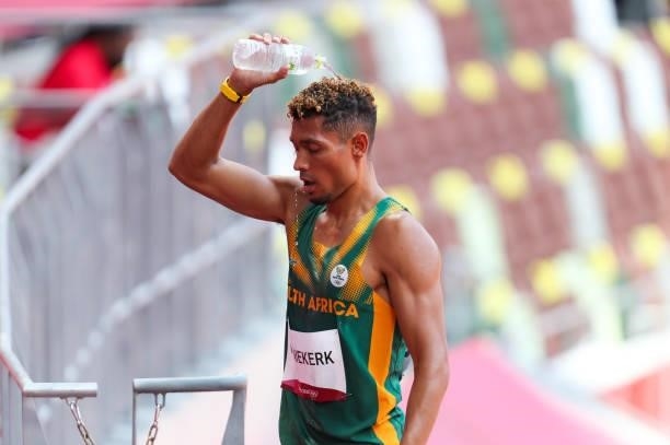 Wayde van Niekerk of South Africa, World and Olympic record holder in the mens 400m, pours cold water on his head after he ran in the heats in the...