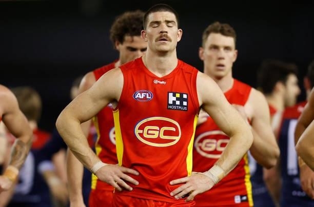 Sam Collins of the Suns looks dejected after a loss during the 2021 AFL Round 20 match between the Gold Coast Suns and the Melbourne Demons at Marvel...