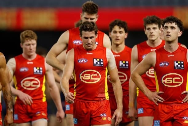 David Swallow of the Suns looks dejected after a loss during the 2021 AFL Round 20 match between the Gold Coast Suns and the Melbourne Demons at...