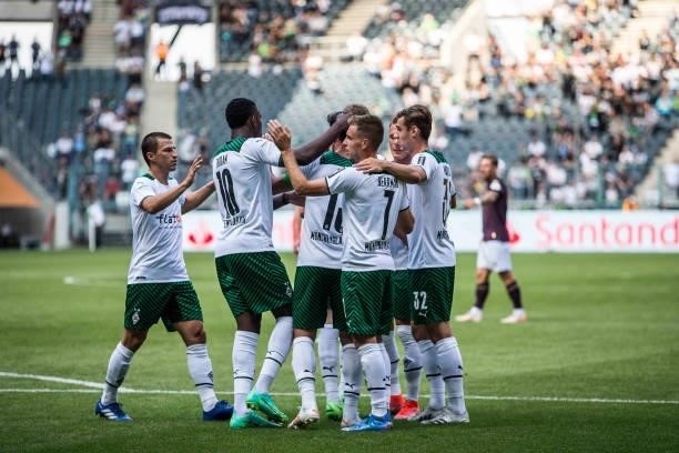 Lars Stindl of Borussia Moenchengladbach celebrate with team mates after he score his teams first goal during the Pre-Season match between Borussia...