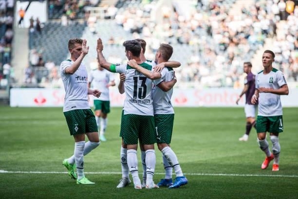 Lars Stindl of Borussia Moenchengladbach celebrate with team mates after he score his teams first goal during the Pre-Season match between Borussia...
