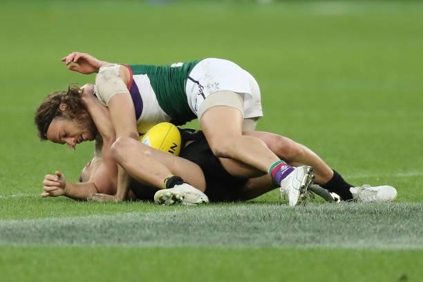 James Aish of the Dockers wrestles with Dion Prestia of the Tigers during the 2021 AFL Round 20 match between the Fremantle Dockers and the Richmond...