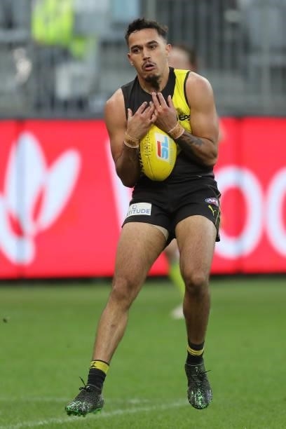 Sydney Stack of the Tigers marks the ball during the 2021 AFL Round 20 match between the Fremantle Dockers and the Richmond Tigers at Optus Stadium...