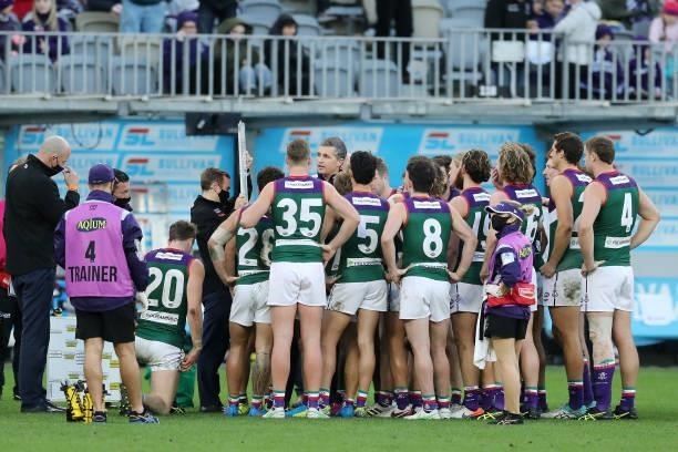 Justin Longmuir, Senior Coach of the Dockers addresses the team at three quarter time break during the 2021 AFL Round 20 match between the Fremantle...