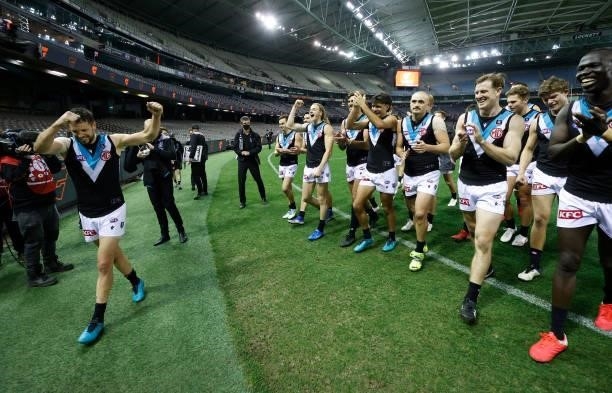 Travis Boak of the Power celebrates with teammates during the 2021 AFL Round 20 match between the GWS Giants and the Port Adelaide Power at Marvel...