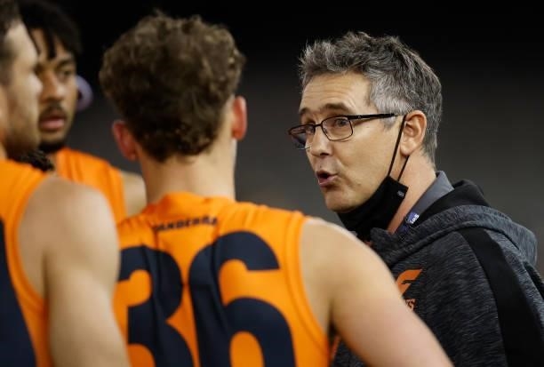 Leon Cameron, Senior Coach of the Giants addresses his players during the 2021 AFL Round 20 match between the GWS Giants and the Port Adelaide Power...