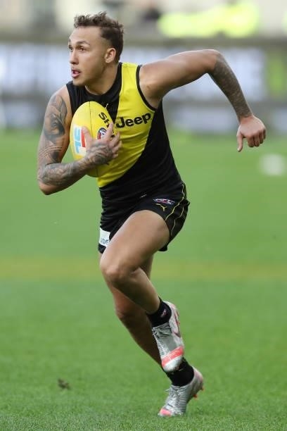 Shai Bolton of the Tigers looks to pass the ball during the 2021 AFL Round 20 match between the Fremantle Dockers and the Richmond Tigers at Optus...