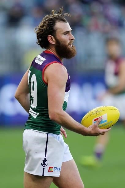 Connor Blakely of the Dockers looks to pass the ball during the 2021 AFL Round 20 match between the Fremantle Dockers and the Richmond Tigers at...