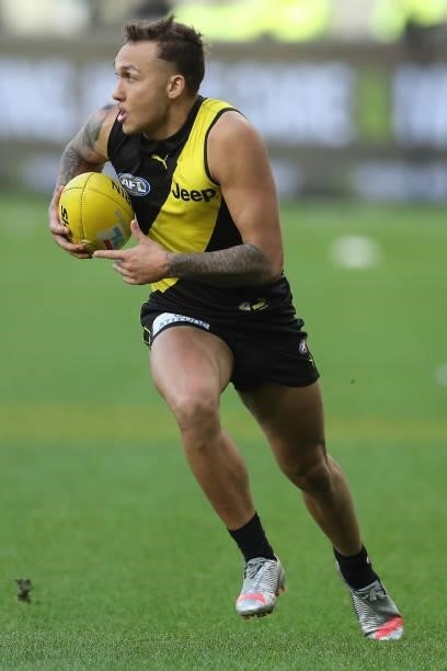 Shai Bolton of the Tigers looks to pass the ball during the 2021 AFL Round 20 match between the Fremantle Dockers and the Richmond Tigers at Optus...