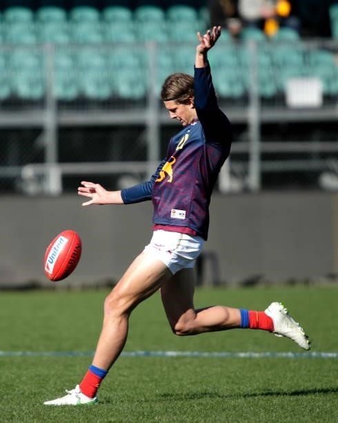 Tom Fullarton of the Lions kicks the ball during the warm up before the 2021 AFL Round 20 match between the Hawthorn Hawks and the Brisbane Lions at...