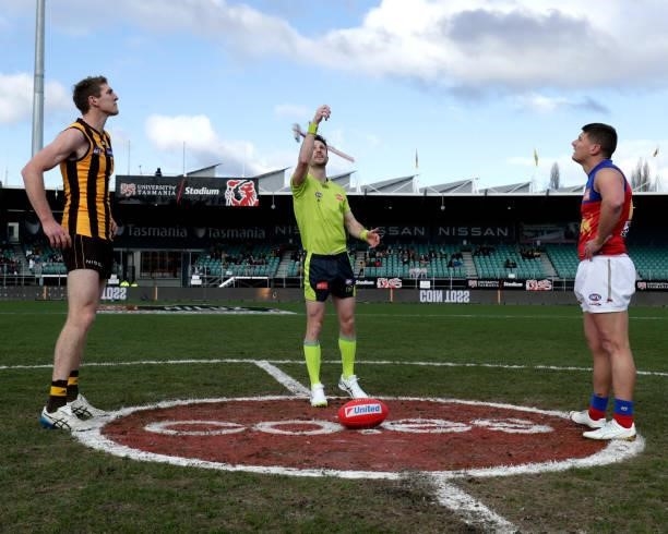 Ben McEvoy of the Hawks and Dayne Zorko of the Lions at the coin toss during the 2021 AFL Round 20 match between the Hawthorn Hawks and the Brisbane...