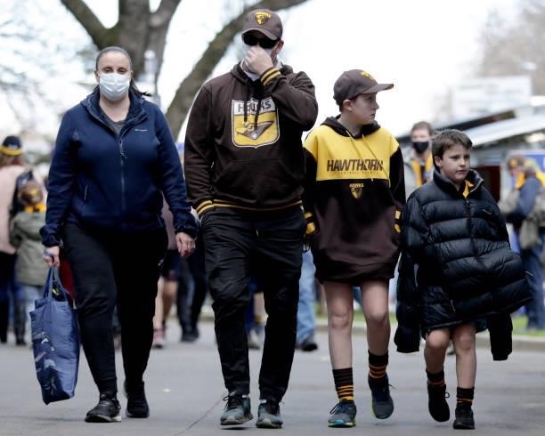 Fans entering the ground before the 2021 AFL Round 20 match between the Hawthorn Hawks and the Brisbane Lions at UTAS Stadium on August 1, 2021 in...