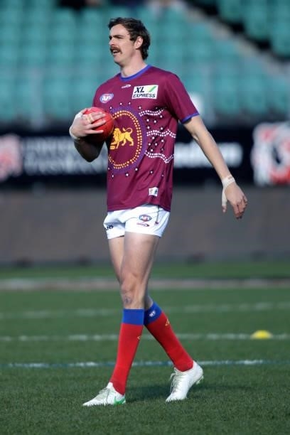 Joe Daniher of the Lions warming up before the 2021 AFL Round 20 match between the Hawthorn Hawks and the Brisbane Lions at UTAS Stadium on August 1,...