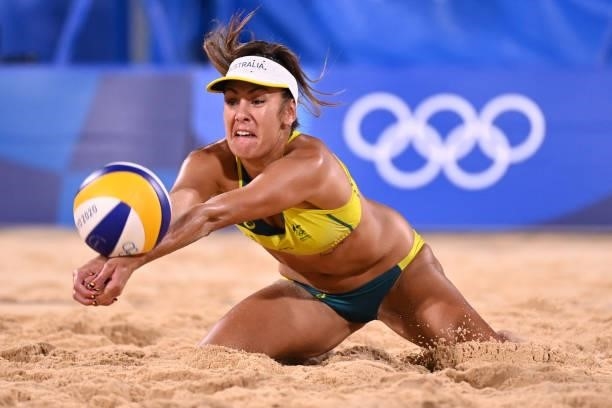 Australia's Taliqua Clancy dives for the ball in their women's beach volleyball round of 16 match between Australia and China during the Tokyo 2020...