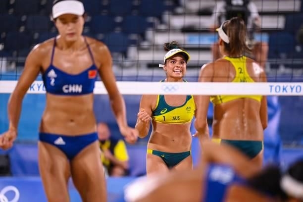 Australia's Mariafe Artacho del Solar gestures to partner Taliqua Clancy in their women's beach volleyball round of 16 match between Australia and...