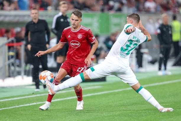 Nicklas Shpnoski of Fortuna Duesseldorf and Marco Friedl of SV Werder Bremen battle for the Ball during the Second Bundesliga match between Fortuna...