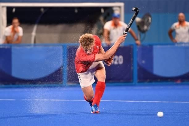 Britain's Jacob Benjamin Draper strikes the ball during the men's quarter-final match of the Tokyo 2020 Olympic Games field hockey competition...