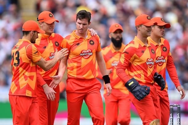 Adam Milne of the Birmingham Phoenix celebrates with team mates after taking the wicket of D'arcy Short of the Trent Rockets during The Hundred match...