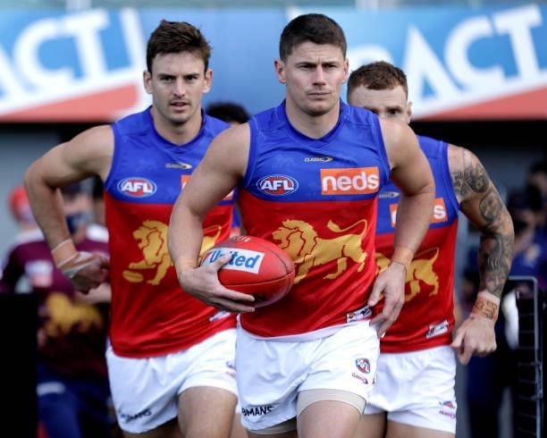 Dayne Zorko of the Lions leads out the team during the 2021 AFL Round 20 match between the Hawthorn Hawks and the Brisbane Lions at UTAS Stadium on...