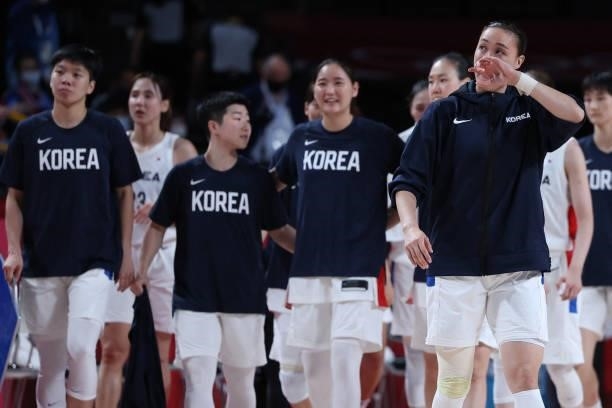 South Korean players react after the women's preliminary round group A basketball match between South Korea and Serbia during the Tokyo 2020 Olympic...
