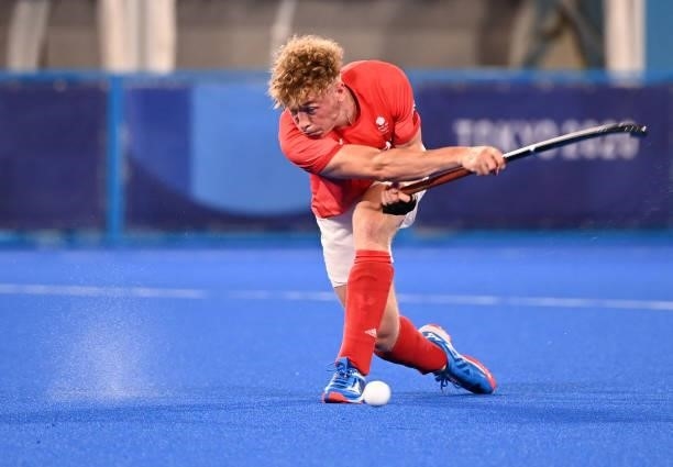 Britain's Jacob Benjamin Draper strikes the ball during the men's quarter-final match of the Tokyo 2020 Olympic Games field hockey competition...