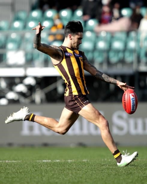 Chad Wingard of the Hawks kicks the ball during the 2021 AFL Round 20 match between the Hawthorn Hawks and the Brisbane Lions at UTAS Stadium on...