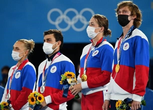 Silver medallists Russia's Elena Vesnina and Russia's Aslan Karatsev, and Gold medallists Russia's Anastasia Pavlyuchenkova and Russia's Andrey...