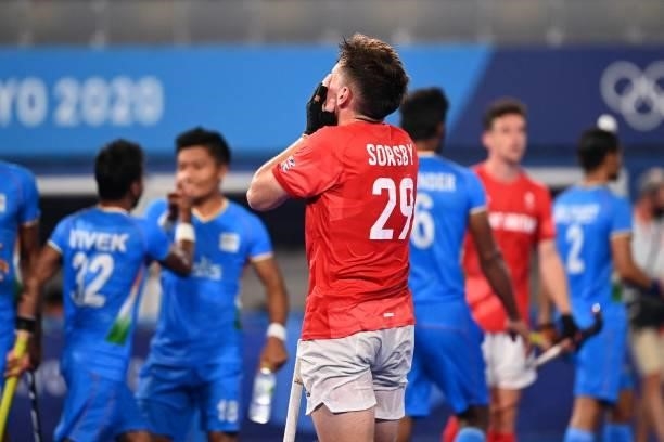 Britain's Thomas Sorsby reacts after losing 3-1 to India in their men's quarter-final match of the Tokyo 2020 Olympic Games field hockey competition,...