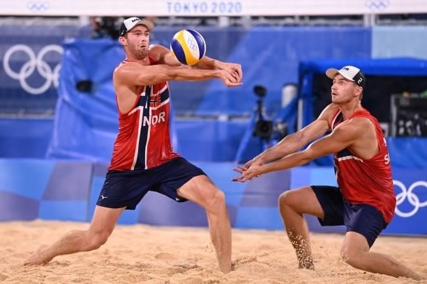 Norway's Anders Berntsen Mol and Norway's Christian Sandlie Sorum reach for the ball in their men's beach volleyball round of 16 match between Norway...