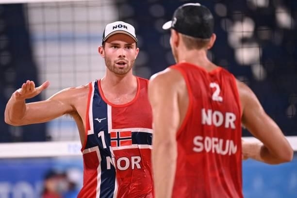 Norway's Anders Berntsen Mol gestures to partner Christian Sandlie Sorum in their men's beach volleyball round of 16 match between Norway and the...