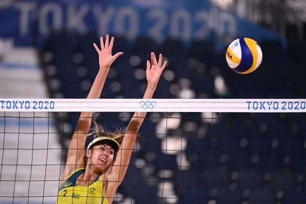 Australia's Taliqua Clancy blocks a shot in their women's beach volleyball round of 16 match between Australia and China during the Tokyo 2020...