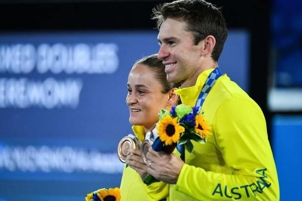 Bronze medallists Australia's Ashleigh Barty and Australia's John Peers pose with their medal during the Tokyo 2020 Olympic mixed doubles tennis...