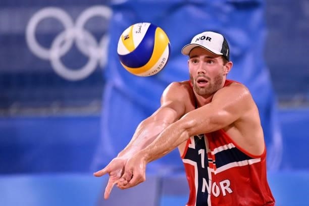 Norway's Anders Berntsen Mol digs the ball in their men's beach volleyball round of 16 match between Norway and the Netherlands during the Tokyo 2020...
