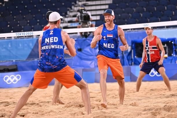 Netherlands' Robert Meeuwsen and partner Alexander Brouwer react in their men's beach volleyball round of 16 match between Norway and the Netherlands...