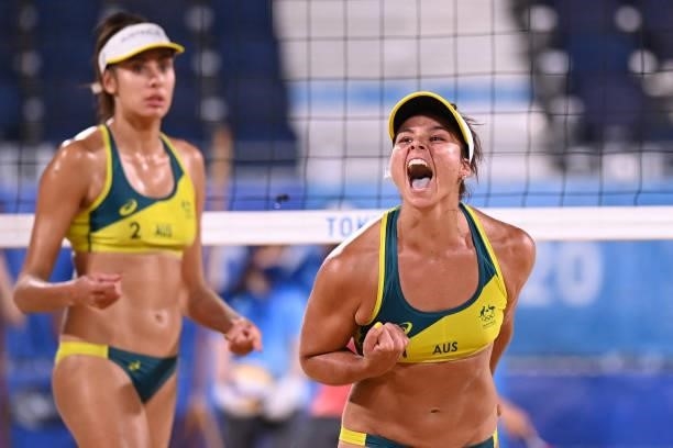 Australia's Mariafe Artacho del Solar reacts beside partner Taliqua Clancy in their women's beach volleyball round of 16 match between Australia and...