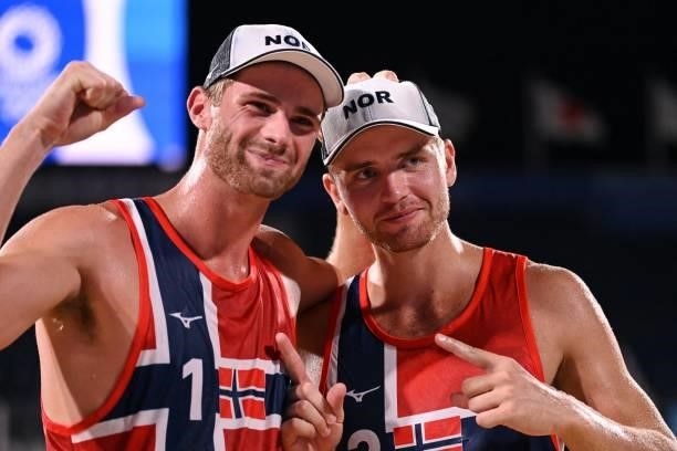 Norway's Anders Berntsen Mol and partner Norway's Christian Sandlie Sorum celebrate winning their men's beach volleyball round of 16 match between...
