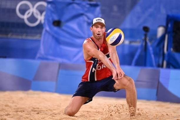 Norway's Anders Berntsen Mol digs the ball in their men's beach volleyball round of 16 match between Norway and the Netherlands during the Tokyo 2020...