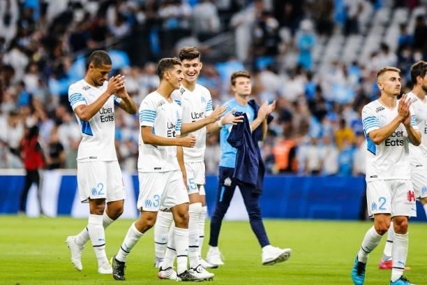 William SALIBA, Oussama TARGHALLINE and Leonardo BALERDI of Marseille thanks the fans after the friendly football match between Marseille and...
