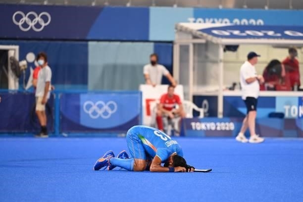India's Harmanpreet Singh reacts after defeating Britain 3-1 in the men's quarter-final match of the Tokyo 2020 Olympic Games field hockey...