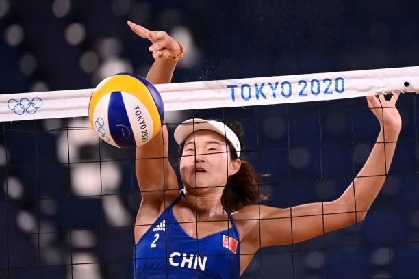 China's Wang Xinxin hits a shot in their women's beach volleyball round of 16 match between Australia and China during the Tokyo 2020 Olympic Games...