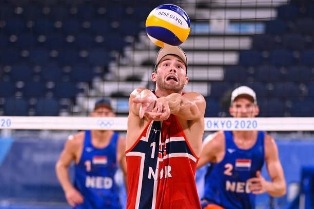 Norway's Anders Berntsen Mol eyes the ball in their men's beach volleyball round of 16 match between Norway and the Netherlands during the Tokyo 2020...