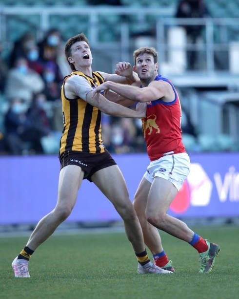 Mitch Lewis of the Hawks and Grant Birchall of the Lions compete for the ball during the 2021 AFL Round 20 match between the Hawthorn Hawks and the...